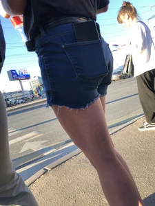 Cute candid teen wearing denim shorts crossing the street, awesome muscly legs