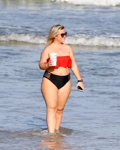 Thick BBW blonde lady in a bikini at the beach
