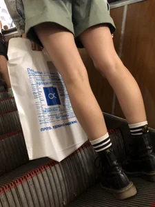 Skinny Female Legs in Shorts on the Subway Escalator Closeups