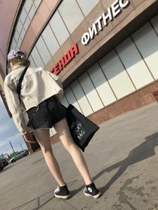 Cute candid teen with pale slim legs in shorts