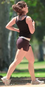 Cute girl running in short shorts