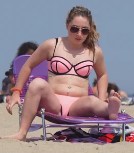Cute babe in pink and black bikini with a bit of camel toe