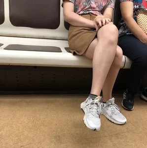 Amazing Hot Girl in a Skirt and Sneakers Sitting Cross-Legged in the Subway Train and on the Escalator Candid Photos Gallery