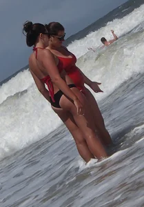 Fat chick on the beach in a red swimsuit