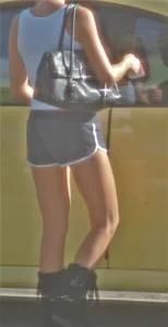 Skinny babe going to her car in little cotton shorts