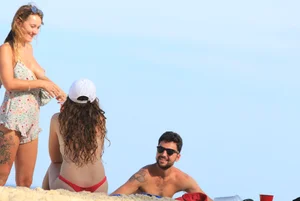 Sexy girls topless on a nude beach showing their nice tits