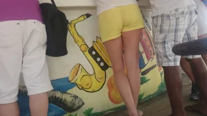 Milf in yellow shorts with vpl and a wedgie