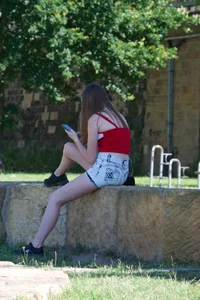 Pretty candid girls with nice legs sitting in denim shorts