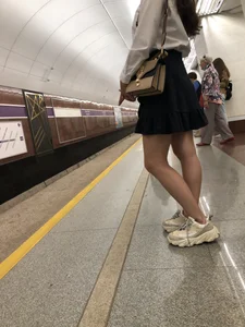 Girl in a Blouse And a Skirt With Great Legs Creepshots Gallery - Standing on the Subway Station, then Sitting With Crossed Legs in a Train