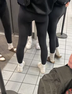 Tight ass sports team in line at airport