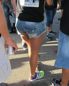 Brunette babe standing around in denim shorts