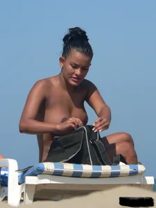 Hot ass topless beach girl with great tits lets her little brother oil up her ass in thong bikini