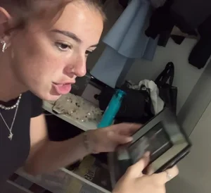 Cute Curvy Thin Woman Distracted While Tidying Room Candids