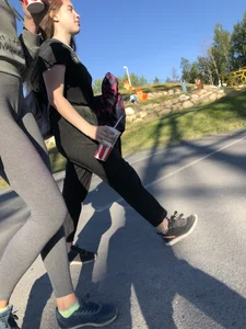 Skinny Girl in Grey Leggings Walking Past the Camera Candid Photos Gallery