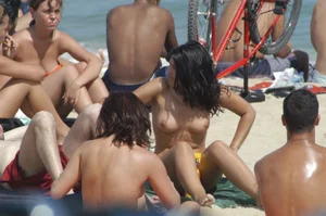 Topless girls on a beach in Barcelona