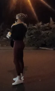 Athletic bubble butt blonde in leggings waiting for Uber pickup.