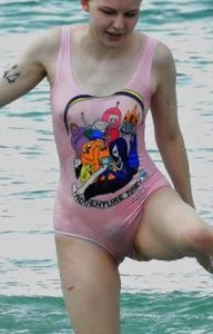 Miley Cyrus' friend in pink see through swimsuit showing nipples and pussy hair