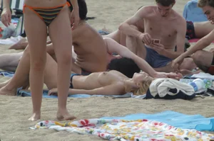 Topless girls on a beach in Barcelona
