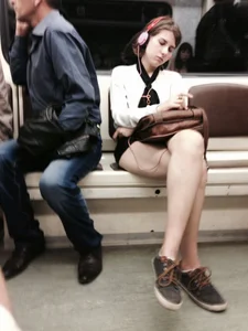 Teen With Nice Legs Sitting With Crossed Legs in a Subway Train Creepshot