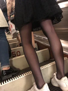 Thin Hot Legs in Black Pantyhose and a Seethrough Skirt on the Subway Escalator Creepshots