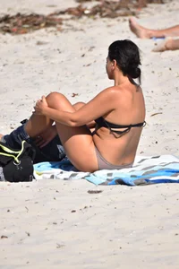 Thick mature brunette bikini lady on the beach with a nice body