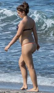 Sexy big booty girl in thong bikini on the beach