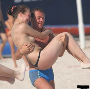 A bunch of sexy beach voyeur babes in bikinis, thongs and topless