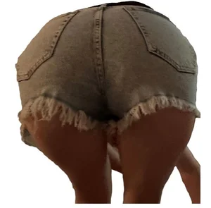 Girl in denim shoerts bending over closeup