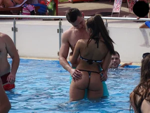 Sexy girl at the pool with a nice ass in thong bikini