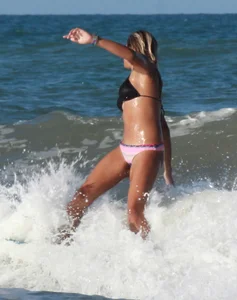 Hot surfer chicks out in the water