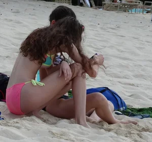 Two candid skinny teen sisters in bikinis