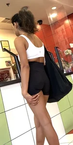 hot petite Indian chick showing some T&A in skimpy workout clothes