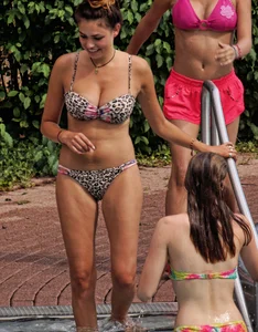 Hot big boobed girl in bikini at the pool