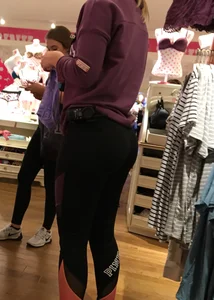 Pink employee with a perfectly round ass in leggings