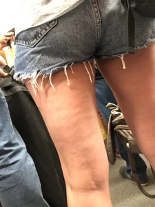 Girl in Denim Mini Shorts and Sandals With Sexy Legs And Feet Street and Subway Photos