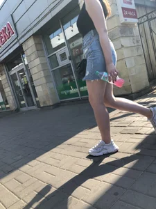 Hot chick wearing a fringed skirt walking up the stairs