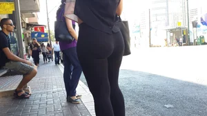 Sexy ass in leggings waiting for the bus