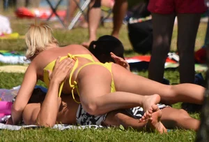Blonde looking sexy in a yellow bikin