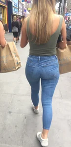 Sexy girl walking in grey patterned leggings with friend in tight jeans