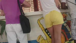 Milf in yellow shorts with vpl and a wedgie