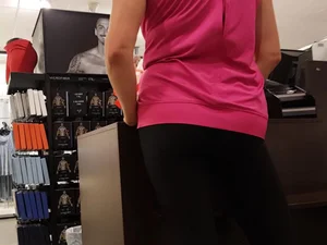 Nice ass in leggings standing in line shopping
