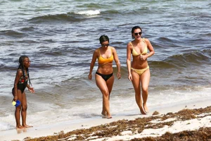 Frankie Bridge nip slips in a bikini on the beach