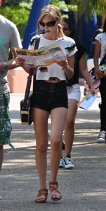 Skinny blonde chick in little denim shorts