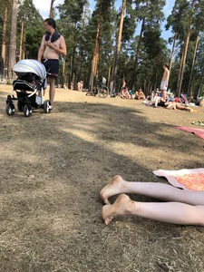 Pale Girl in Swimsuit Lying on a Lake Beach With Her Friends Creepshots Gallery