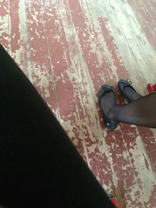 College Teen’s Legs in Black Pantyhose And Feet in Flats Closeup Photos