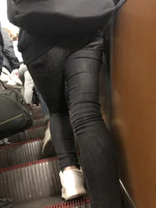 Legs in Tight Jeans Escalator Closeup