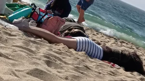 Beautiful Teen with Miniskirt resting on the beach