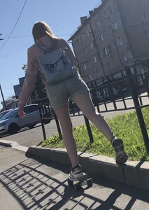 Girl in Denim Shorts on Skateboard Street Candid Photos