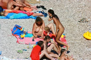 Ula FKK Sexy brunette on a nude beach topless, bottomless and with blue thong