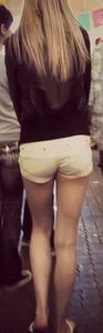 Skinny blonde girl in little yellow shorts with a tight ass